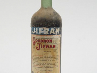 Vente aux enchères 1 TRES VIEILLE BOUTEILLE GOUDRON JIFRAN 