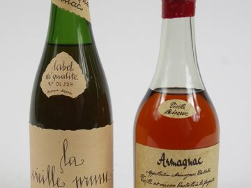 2 DEMIES BOUTEILLES : 1 ARMAGNAC RESERVE MAESTROGUAN - 1 VIEILLE PRUNE