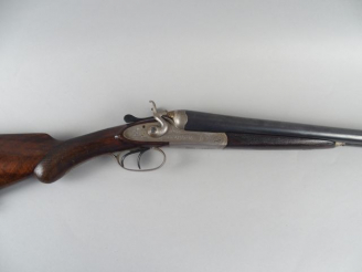 Vente aux enchères 199- Fusil juxtaposé a chiens extérieurs. Calibre 12/65. Crosse demi-p