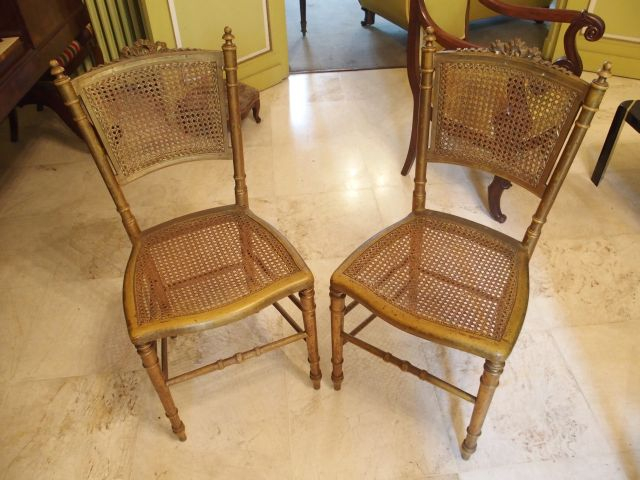 Paire de chaises cannées 1900, de style Louis XVI, en bois doré