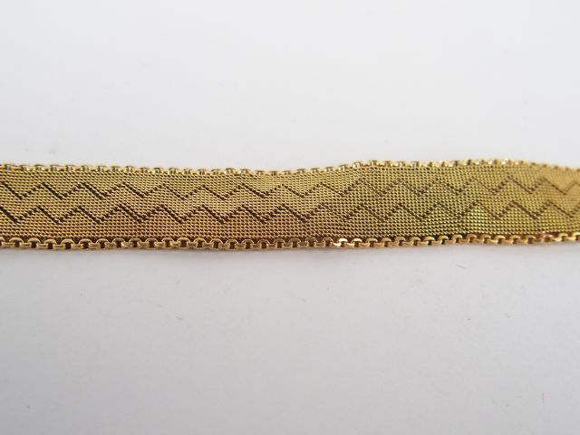 Bracelet ceinture en or jaune (restauré). Fermoir à cliquet. Poids: 18