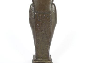 Sujet en bronze 'ouchebti'. H. : 14 m