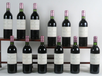 Vente aux enchères 12 BOUTEILLES CHÂTEAU LARMANDE GCC ST EMILION - 1982 - 4 BG