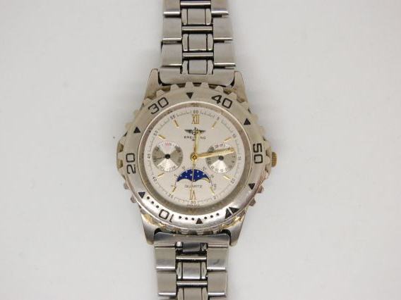 BREITLING. Montre d'homme en acier, jour, mois et phases de la lune