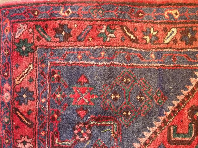 Tapis d'Orient fond rouge
