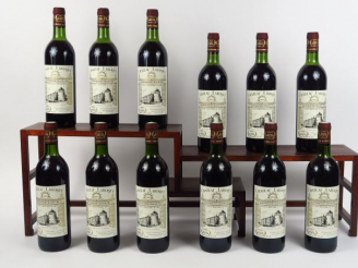 Vente aux enchères 12 BOUTEILLES CHÂTEAU LAROQUE GC ST EMILION - 1983 - CBO - 8 LB /4 HEP