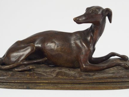 Sujet en bronze fin XIXème début XXème à patine brune "Lévrier couché"