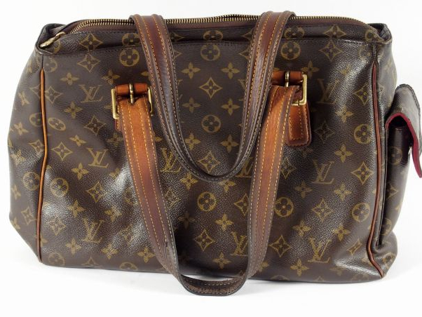 Louis VUITTON. Sac en cuir monogrammé (usé).