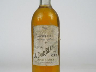 Vente aux enchères 1 BOUTEILLE CHÂTEAU LA TOUR BLANCHE 1er CC SAUTERNES - 1957 - BG/EA/BL