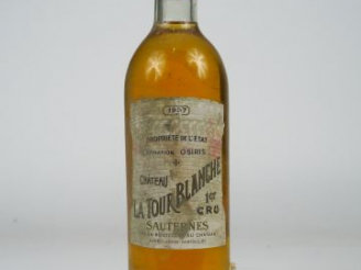 Vente aux enchères 1 BOUTEILLE CHÂTEAU LA TOUR BLANCHE 1er CC SAUTERNES - 1957 - BG+/ELA/