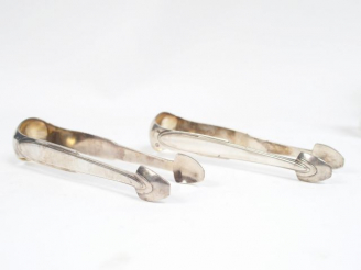 Vente aux enchères Paire de pinces à sucre Art Déco en argent, poinçon Minerve. MO : Ravi