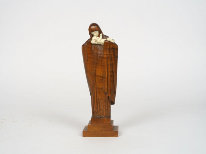 HEUVELMANS "Vierge à l'Enfant" Sculpture en bois naturel et ivoire.  S