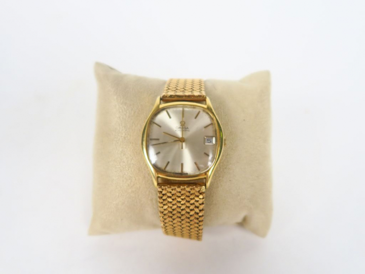 OMEGA.  Montre d'homme, boitier et bracelet or. Avec son certificat. P