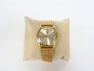 Vente aux enchères OMEGA.  Montre d'homme, boitier et bracelet or. Avec son certificat. P