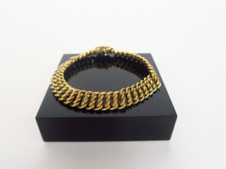 Vente aux enchères Bracelet souple en or jaune, maille américaine.  Poids. 18,12 gr