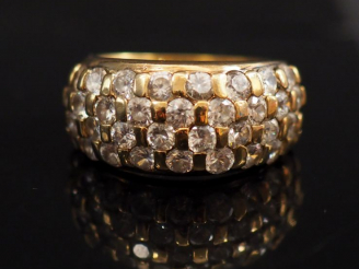 Vente aux enchères Bague jonc en vermeil sertie de pierres à l'imitation du diamant. TDD.
