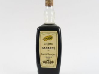 Vente aux enchères 1 BOUTEILLE CRÈME DE BANANES L'ABBÉ FRANÇOIS