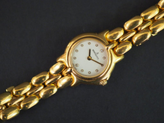 Vente aux enchères BERTOLUCCI. Montre de dame, boitier et bracelet tank en or. Poids tel 