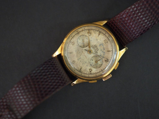 Vente aux enchères CAUNY. Montre d'homme, boitier or.