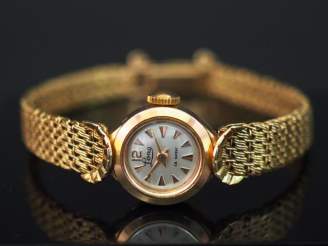 Vente aux enchères 	LORD Montre bracelet de dame  de style 1930 en or jaune. Cadran rond.