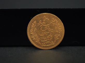 Vente aux enchères 	Une pièce de 10 francs or, Tunisie, 1891-A. FRAIS ACHETEURS 5% TTC.