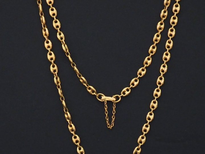 Collier en or jaune, maille grain de café. Chainette de sécurité. Poid
