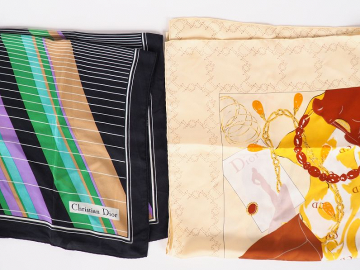 Christian DIOR. Lot de deux foulards en soie, signés.