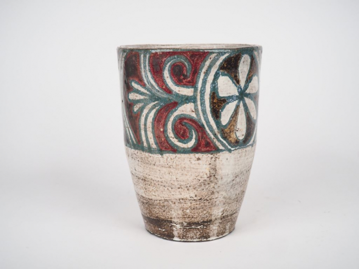 Jean DERVAL. Vase en terre vernissée à décor de feuillage vert sur fon