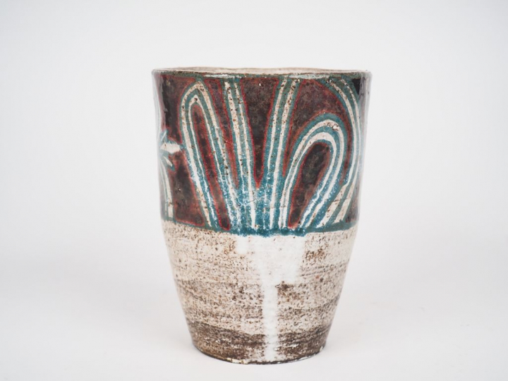 Jean DERVAL. Vase en terre vernissée à décor de feuillage vert sur fon