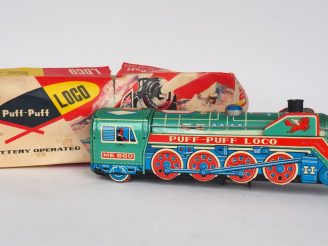 Vente aux enchères PUFPUFF LOCO Battery Operated mystery action. Made in China en boite.