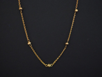 Vente aux enchères Collier souple en or jaune, maille torsadée agrémentée de petites boul