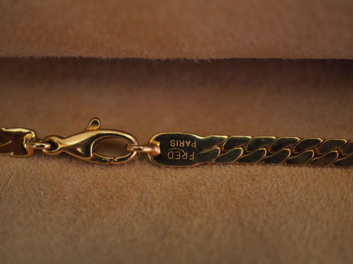 FRED, Paris Collier souple en or jaune, maille plate, agrémenté de tro