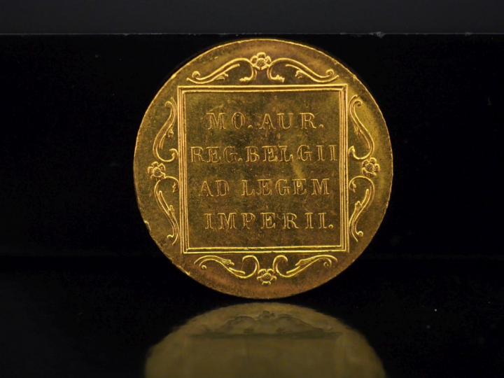 Pièce en or belge, datée 1928.  Poids. 3,50 g   
