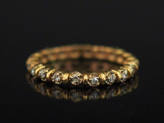 Vente aux enchères Alliance américaine en or jaune, sertie de petits diamants.  TDD. 53 P