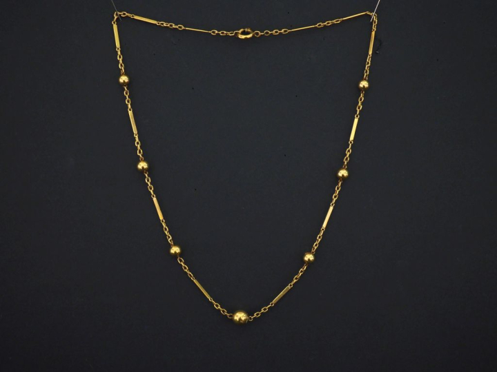Collier souple en or jaune 750, composé de maillons rectangulaires et 