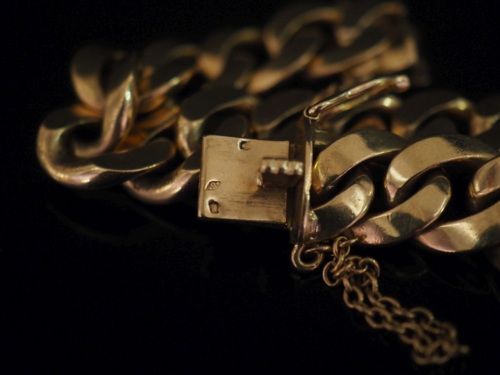 Bracelet souple en or jaune 750, maille gourmette.  Chainette de sécur