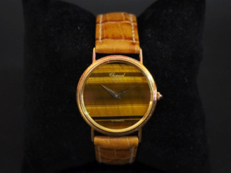 Vente aux enchères CHOPARD, Genève Montre bracelet de dame, boitier en or jaune 750.  Cad