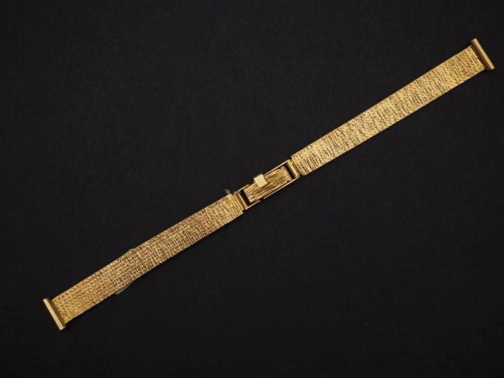 Bracelet de montre en or jaune 750, maille plate articulée.  Long. 14,