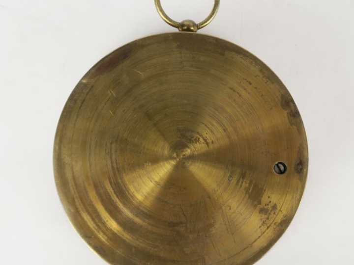 Baromètre / thèrmomètre en laiton mécanisme apparent. Diam. 13 cm.
