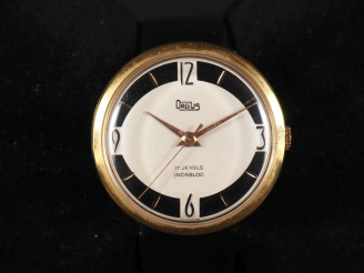 Vente aux enchères ORGUS, Incabloc Montre bracelet en métal doré ou plaqué or.  Cadran ro