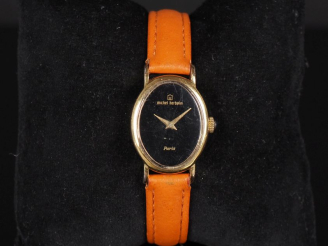 Vente aux enchères Michel HERBELIN, Paris Montre bracelet de dame, boitier en métal doré.