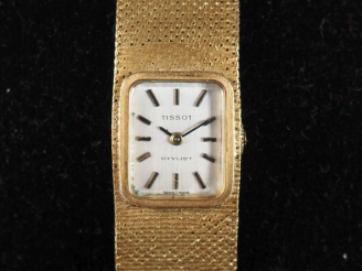 Vente aux enchères TISSOT, Stylist Montre bracelet de dame en or jaune 750.  Cadran recta