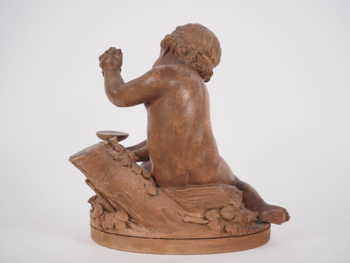 René ROD. "bacchus enfant" Sujet en terre cuite  Signé H. 33,5 cm (pet