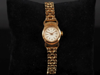 Vente aux enchères LIP N°140021 Montre bracelet de dame, boitier et bracelet en or jaune 