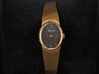 Vente aux enchères BULOVA Montre bracelet de dame, boitier et bracelet en or jaune 750.  