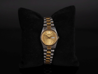 Vente aux enchères SEIKO N°362006 Montre bracelet en acier et métal doré.  Cadran à index