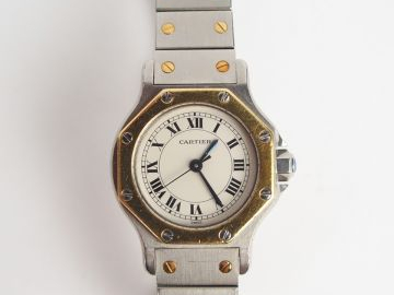 CARTIER. Montre "Tank" dame en or et acier. Numérotée 090734159 et sig