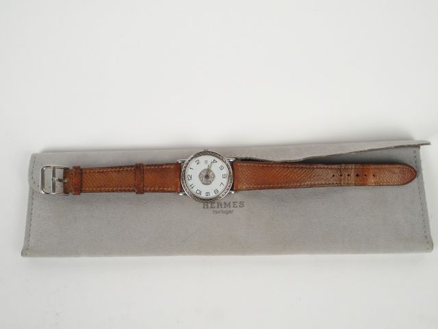 HERMES. Montre homme, modèle Sellier, boitier acier, bracelet cuir mar