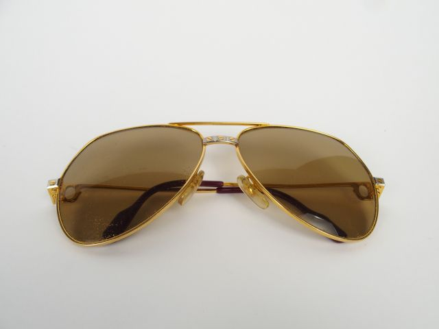 CARTIER. Paire de lunettes Santos, années 80.