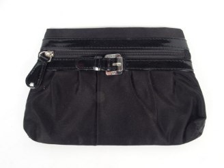 Vente aux enchères Christian DIOR. Porte monnaie en toile noire